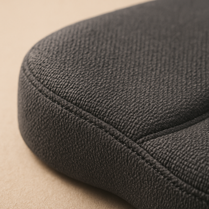Close-up of the LUREXO Support Cushion's textured fabric and stitched seam